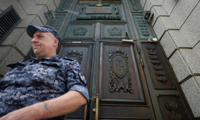 A member of the Russian National Guard leaves the building of Russia's Supreme Court before a hearing on whether to designate Ukraine's Azov Regiment as a terrorist entity in Moscow on Aug. 2, 2022. (Maxim Shemetov/Reuters)