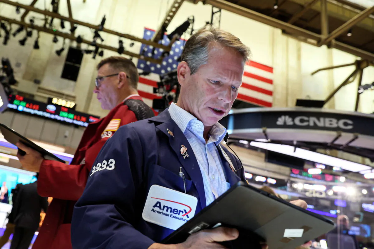 Traders work on the floor of the New York Stock Exchange (NYSE) in New York City on July 27, 2022. (Brendan McDermid/Reuters)