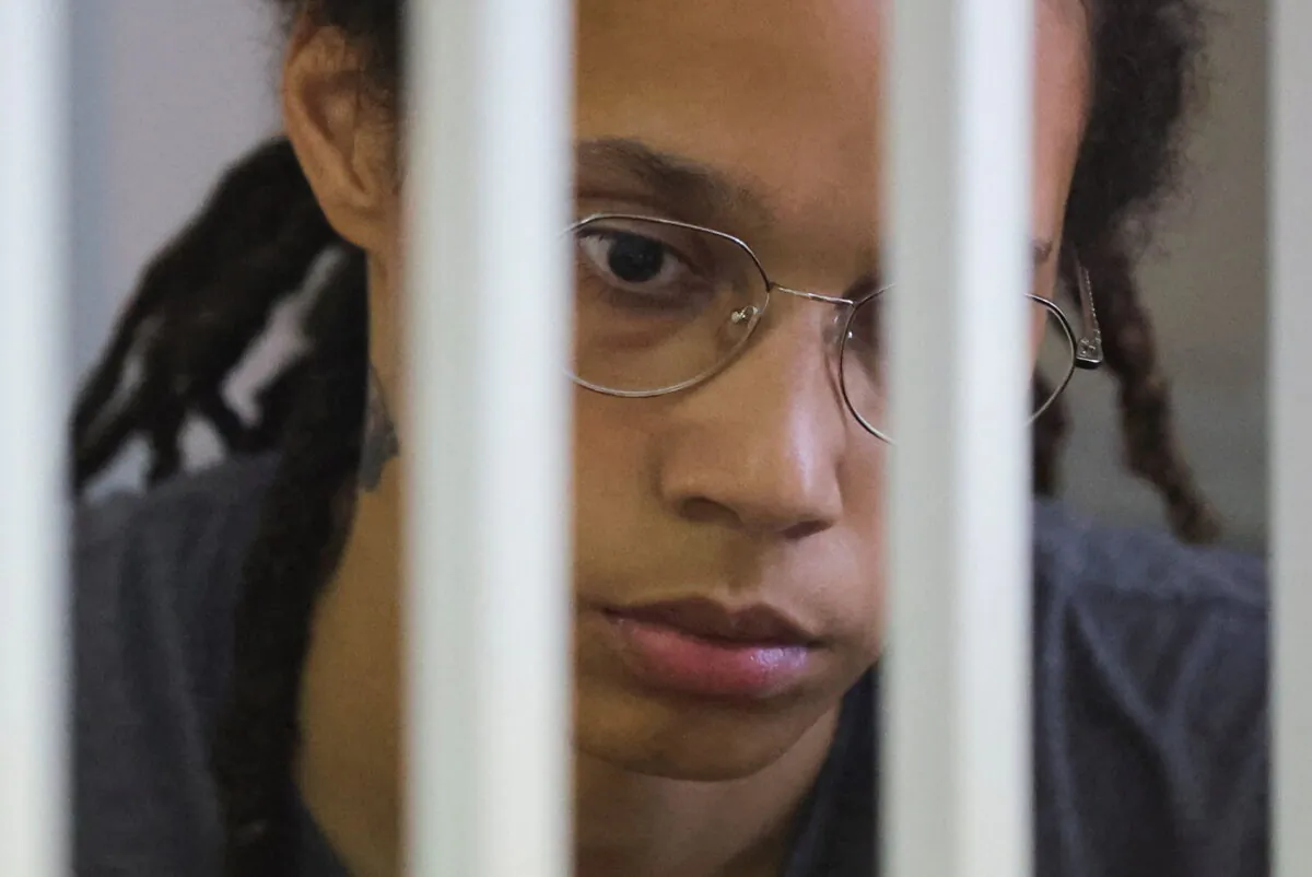 U.S. basketball player Brittney Griner, who was detained at Moscow's Sheremetyevo airport and later charged with illegal possession of cannabis, sits inside a defendants' cage before the court's verdict in Khimki outside Moscow, Russia, August 4, 2022. (Evgenia Novozhenina/Reuters)
