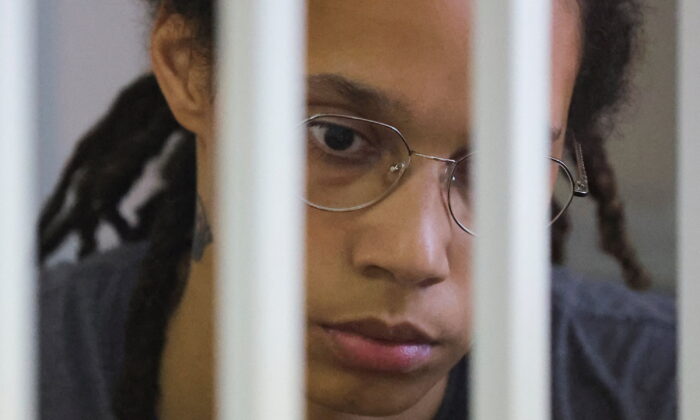 U.S. basketball player Brittney Griner, who was detained at Moscow's Sheremetyevo airport and later charged with illegal possession of cannabis, sits inside a defendants' cage before the court's verdict in Khimki outside Moscow, Russia, August 4, 2022. (Evgenia Novozhenina/Reuters)
