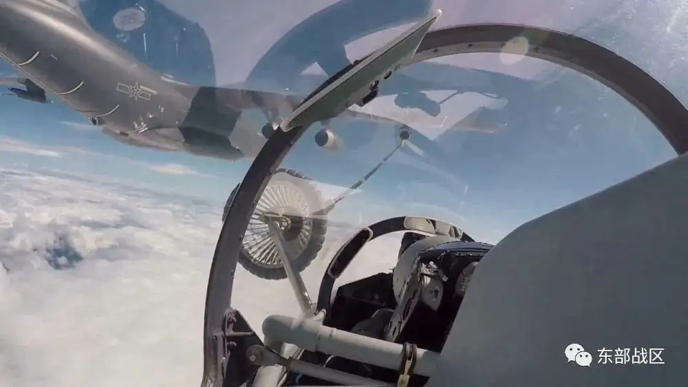 An air force aircraft under the Eastern Theater Command of China's People's Liberation Army (PLA) gets refueled mid-air during military exercises in the waters around Taiwan, in this screengrab from an Aug. 4 video released on Aug. 5, 2022. (Eastern Theater Command/Handout via Reuters)