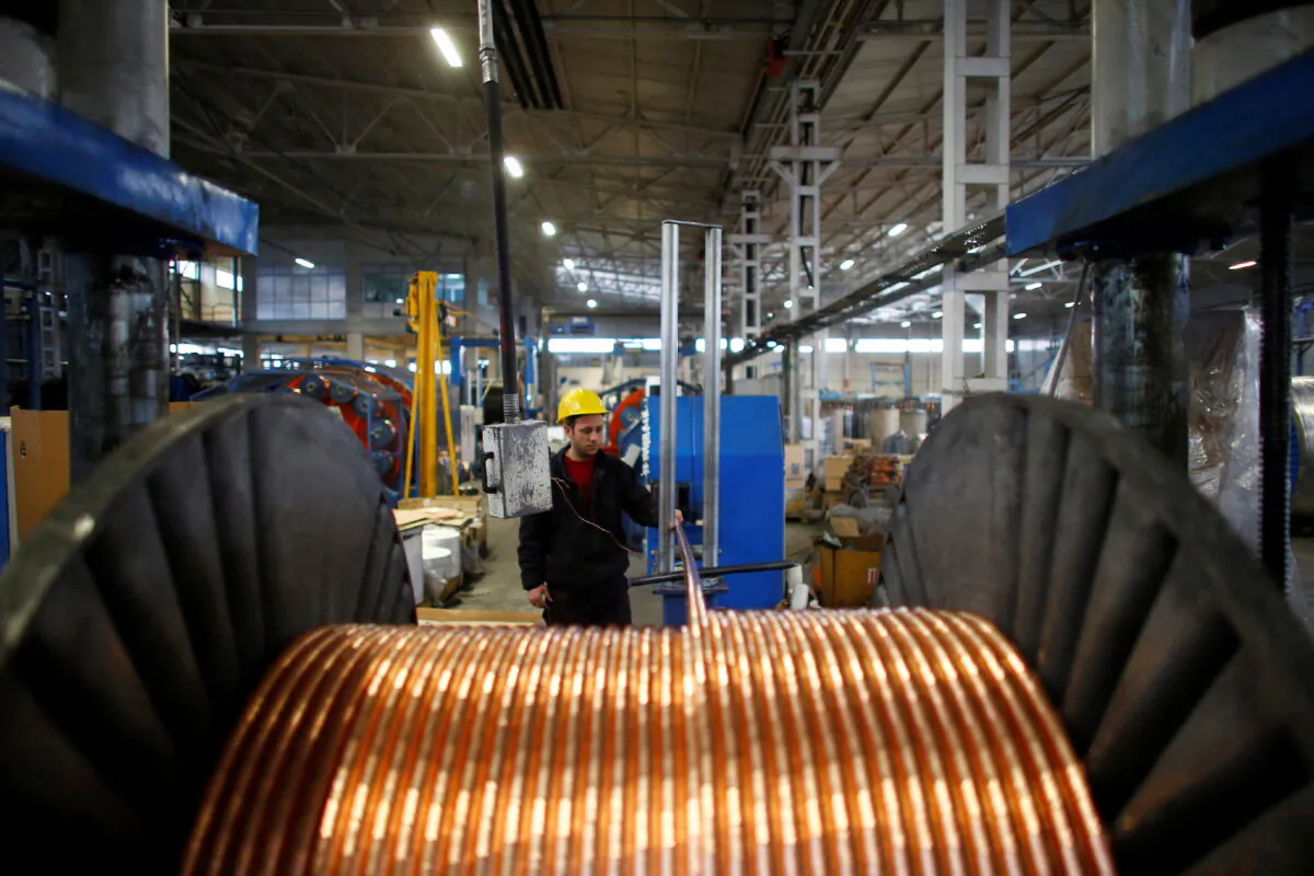 A worker checks copper cables being produced at a factory in the central Anatolian city of Kayseri on Feb. 12, 2015. (Umit Bektas/Reuters)