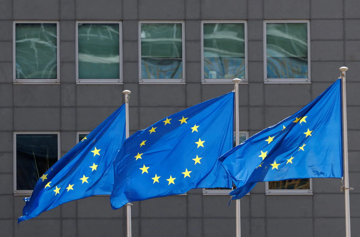 European Union flags flutter outside the EU Commission headquarters in Brussels on June 17, 2022. (Yves Herman/Reuters)