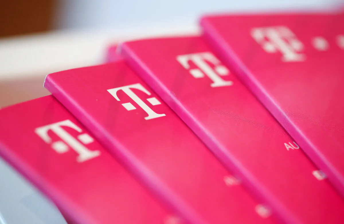 Brochures with the logo of Deutsche Telekom AG at the shop in the headquarters of German telecommunications giant in Bonn, Germany, on Feb. 19, 2019. (Wolfgang Rattay/Reuters)