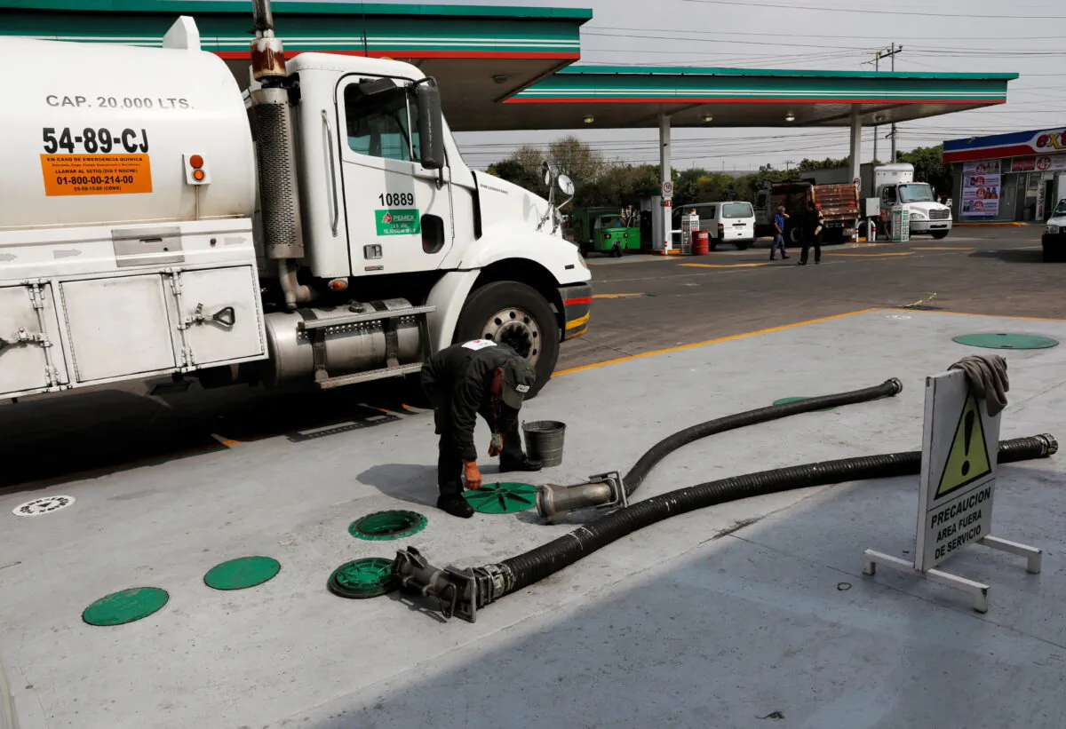 A tanker truck delivers fuel at a gas station in Mexico City on Jan. 14, 2019. (Henry Romero/Reuters)