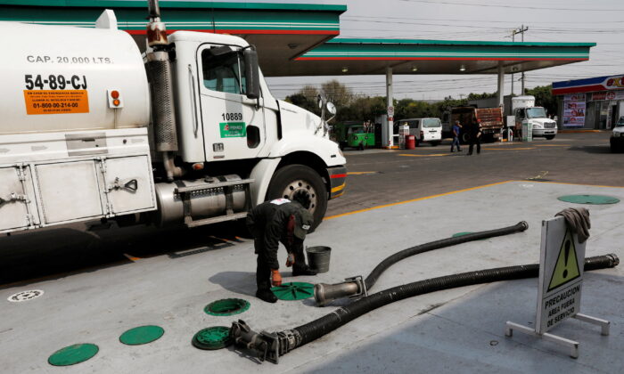 A tanker truck delivers fuel at a gas station in Mexico City on Jan. 14, 2019. (Henry Romero/Reuters)
