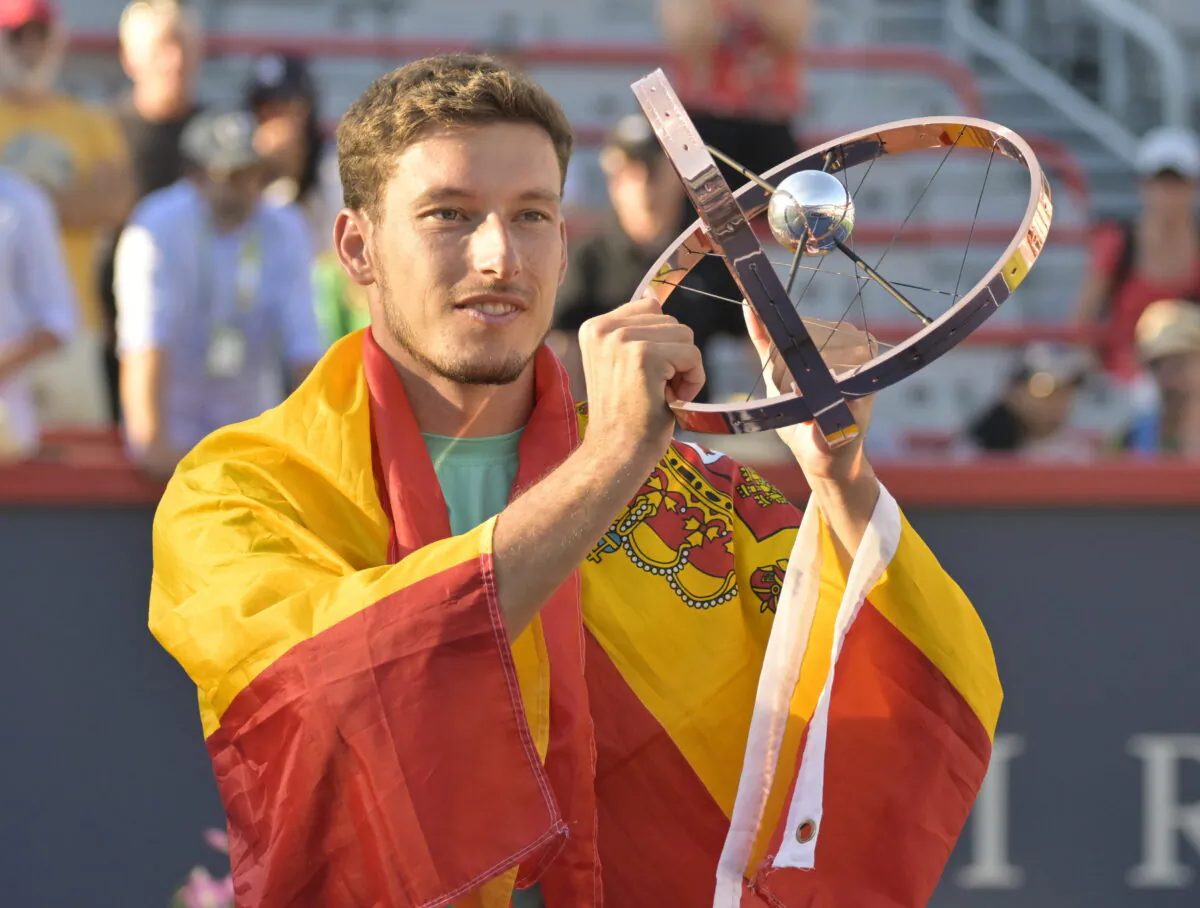 Pablo Carreno Busta (ESP) poses with the championship trophy after winning in the singles finals match during the National Bank Open at IGA Stadium, Montreal, Canada, on Aug 14, 2022. (Eric Bolte/USA TODAY Sports via Reuters)