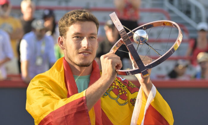 Pablo Carreno Busta (ESP) poses with the championship trophy after winning in the singles finals match during the National Bank Open at IGA Stadium, Montreal, Canada, on Aug 14, 2022. (Eric Bolte/USA TODAY Sports via Reuters)