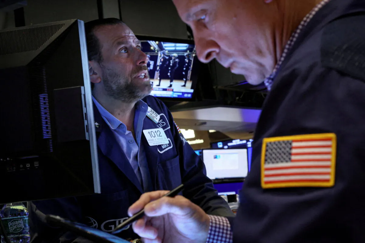 Traders work on the floor of the New York Stock Exchange (NYSE) in New York City on June 22, 2022. (Brendan McDermid/Reuters)