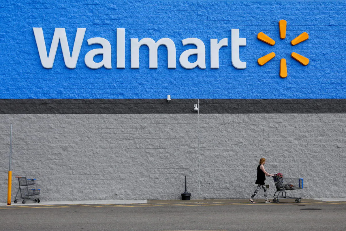 A shopper leaves a Walmart store in Bradford, Pa., on July 20, 2020. (Brendan McDermid/Reuters)