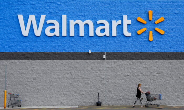 A shopper leaves a Walmart store in Bradford, Pa., on July 20, 2020. (Brendan McDermid/Reuters)