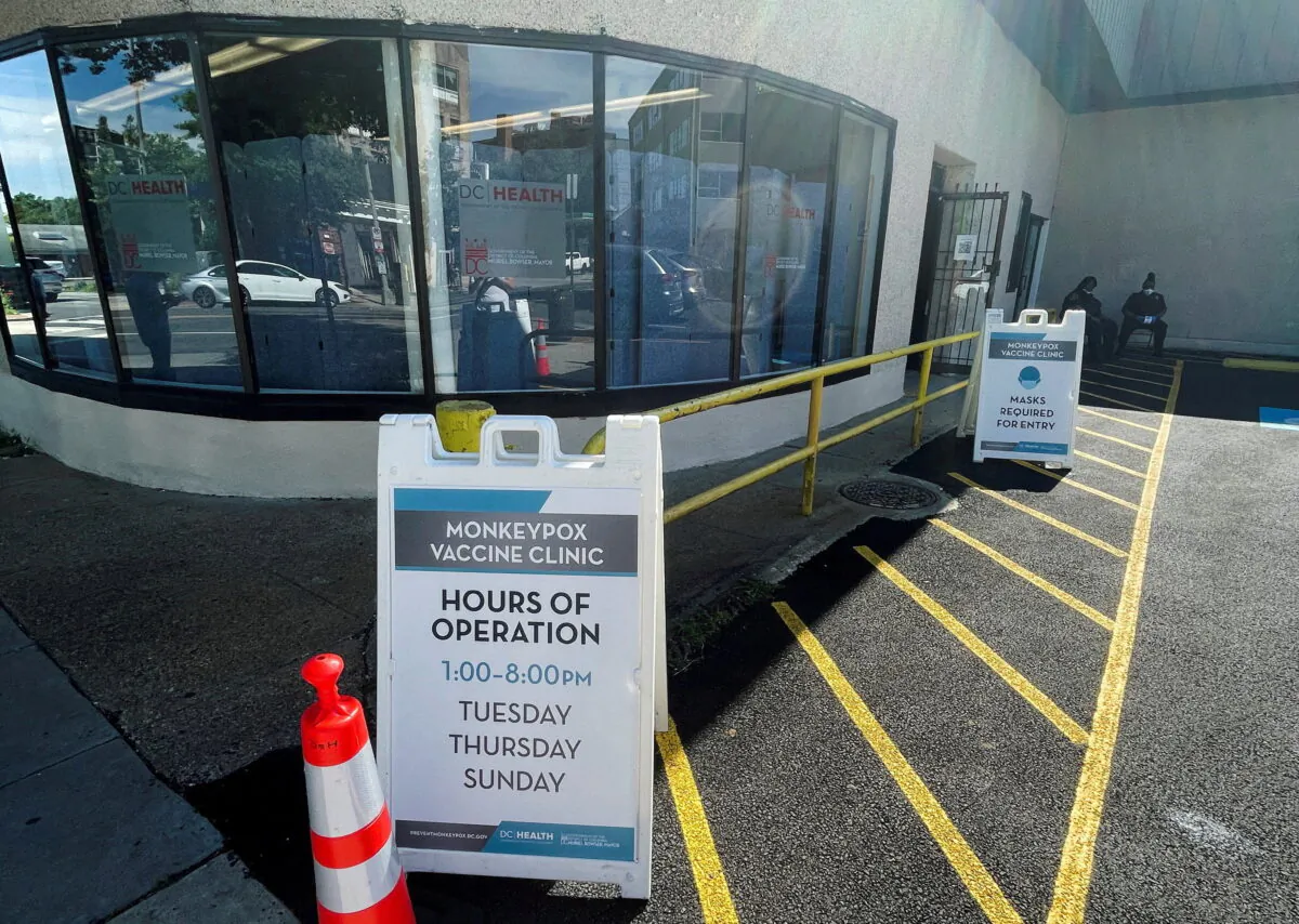 Workers sit outside of D.C. Health's first monkeypox vaccination clinic, which is administering the first Jynneos vaccine doses distributed in the U.S. capital, in Washington on June 28, 2022. (Gavino Garay/Reuters)