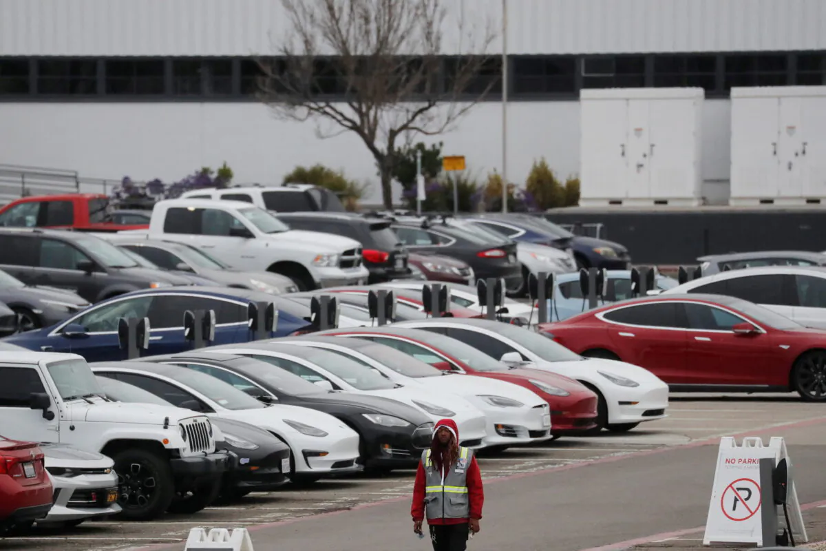 Cars are parked in the employee parking lot at Tesla Inc.'s U.S. vehicle factory in Fremont, Calif., on March 18, 2020. (Shannon Stapleton/Reuters)
