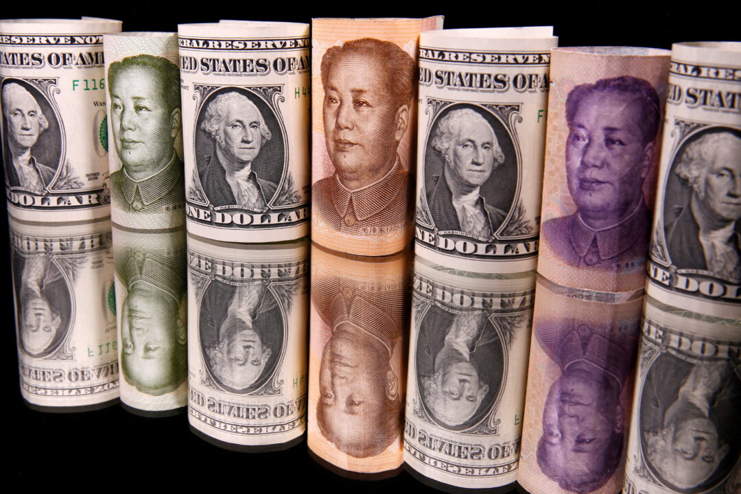 Chinese yuan and U.S. dollar banknotes are seen in this illustration taken on Feb. 10, 2020. (Dado Ruvic/Illustration/Reuters)