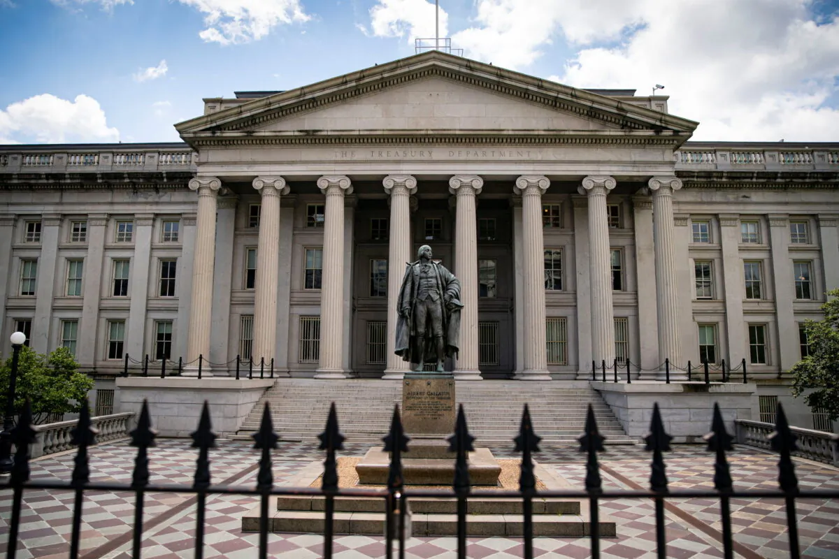 A statue of former Sen. Albert Gallatin stands at the Treasury Department in Washington on April 25, 2021. (Al Drago/Reuters)