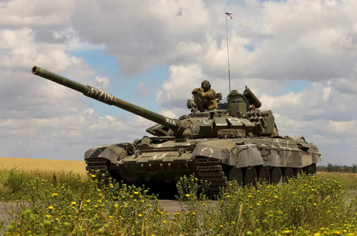 A tank of Russian troops drives in Russian-held part of Zaporizhzhia region, Ukraine, on July 23, 2022. (Alexander Ermochenko/Reuters)