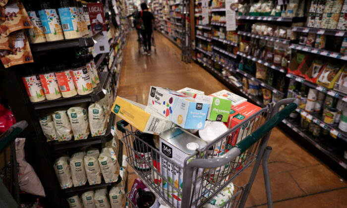 A shopping cart is seen in a supermarket as inflation affected consumer prices in New York City, on June 10, 2022. (Andrew Kelly/Reuters)