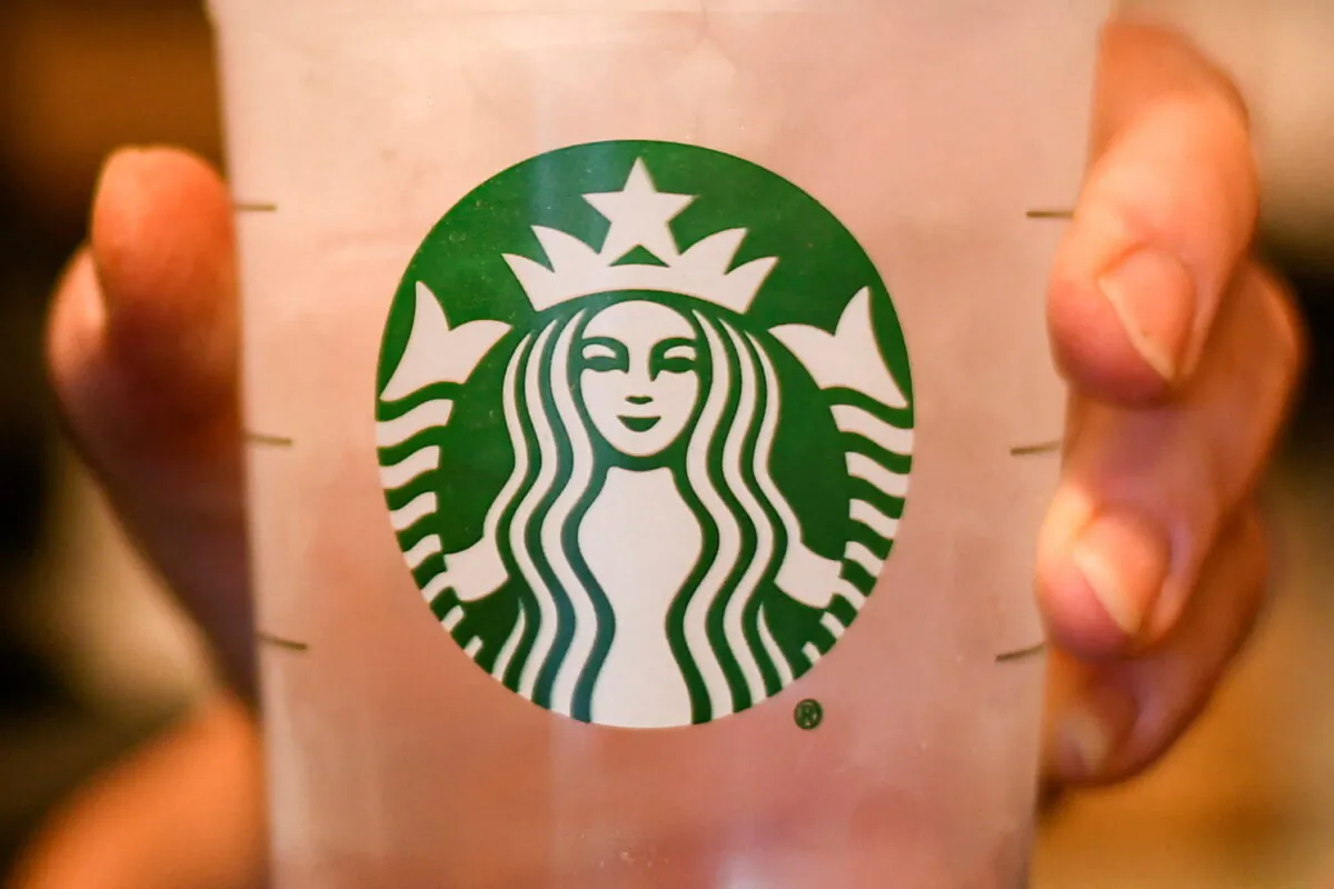 An employees poses with a cup of water at a Starbucks coffeehouse in Austin, Texas, on Feb. 10, 2017. (Mohammad Khursheed/Reuters)