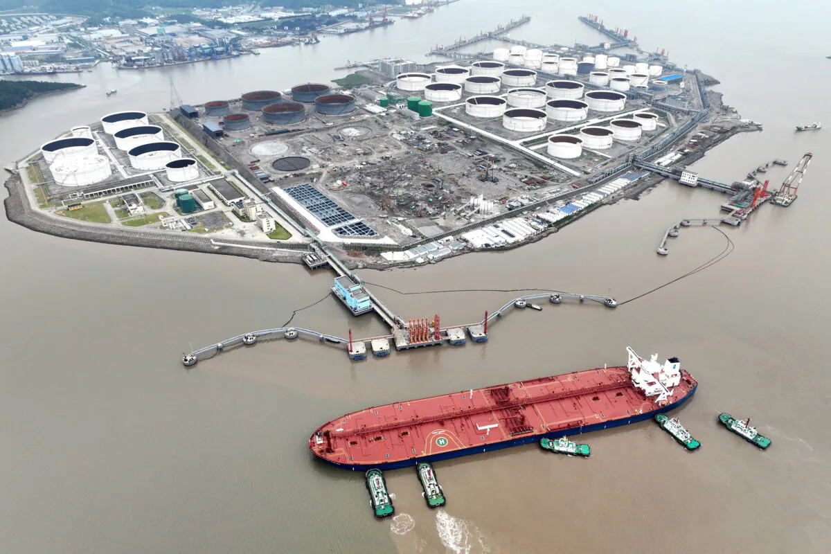 An aerial view shows tugboats helping a crude oil tanker to berth at an oil terminal, off Waidiao Island in Zhoushan, Zhejiang Province, China, on July 18, 2022. (CNS photo via Reuters)