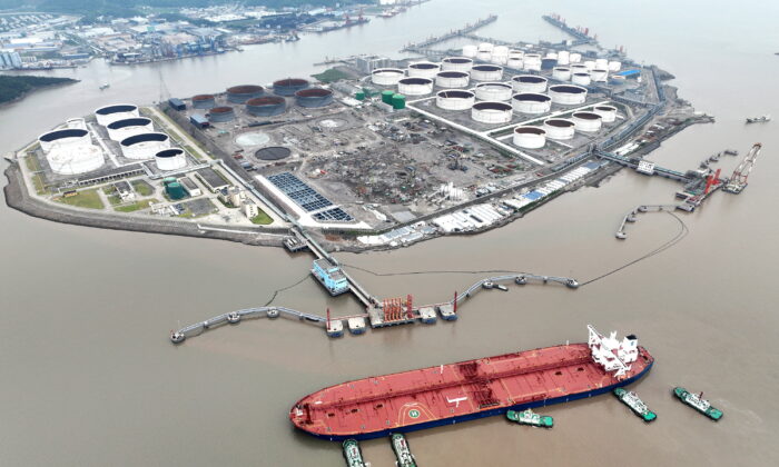 An aerial view shows tugboats helping a crude oil tanker to berth at an oil terminal, off Waidiao Island in Zhoushan, Zhejiang Province, China, on July 18, 2022. (CNS photo via Reuters)