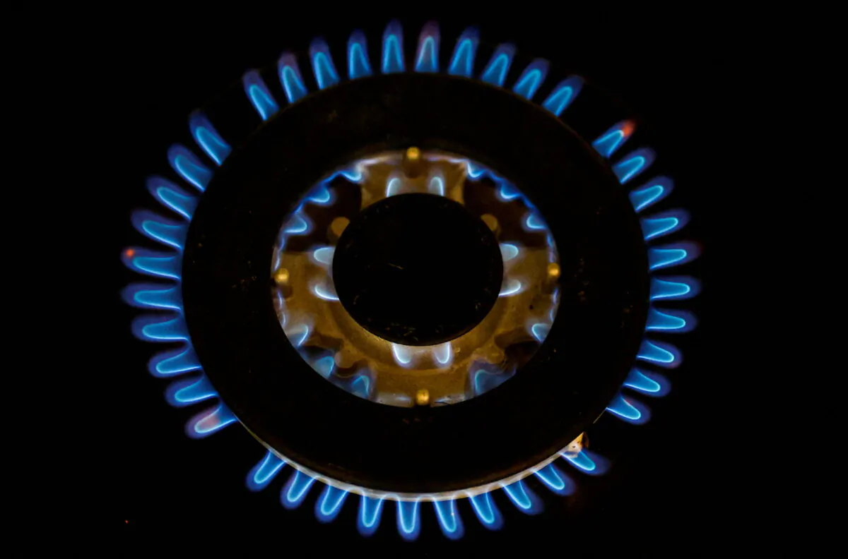 Flames from a gas burner on a cooker are pictured in a private home in this illustration picture taken on June 27, 2022. (Stephane Mahe/Illustration/Reuters)