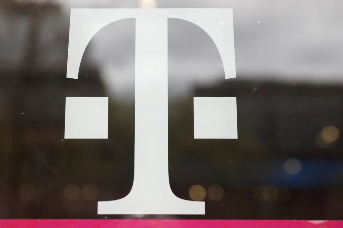 A T-Mobile logo on the storefront door of a store in Manhattan, New York, on April 30, 2018. (Shannon Stapleton/Reuters)