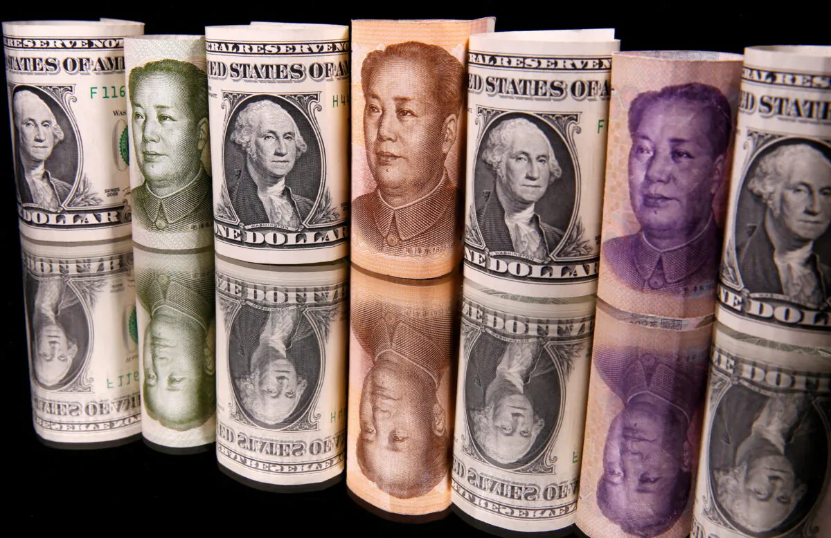 Chinese yuan and U.S. dollar banknotes are seen in this illustration taken on Feb. 10, 2020. (Reuters/Dado Ruvic)