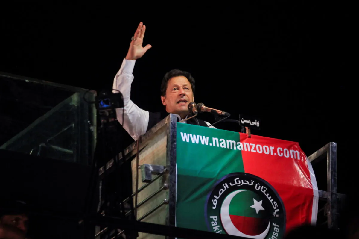 Ousted Pakistani Prime Minister Imran Khan gestures as he addresses supporters during a rally in Lahore, Pakistan, on April 21, 2022. (Mohsin Raza/Reuters)