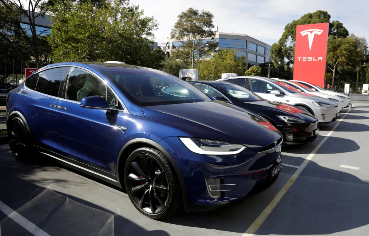 A Tesla Model X car (front) and Model S (2nd L) at a Tesla electric car dealership in Sydney on May 31, 2017. (Jason Reed/Reuters)
