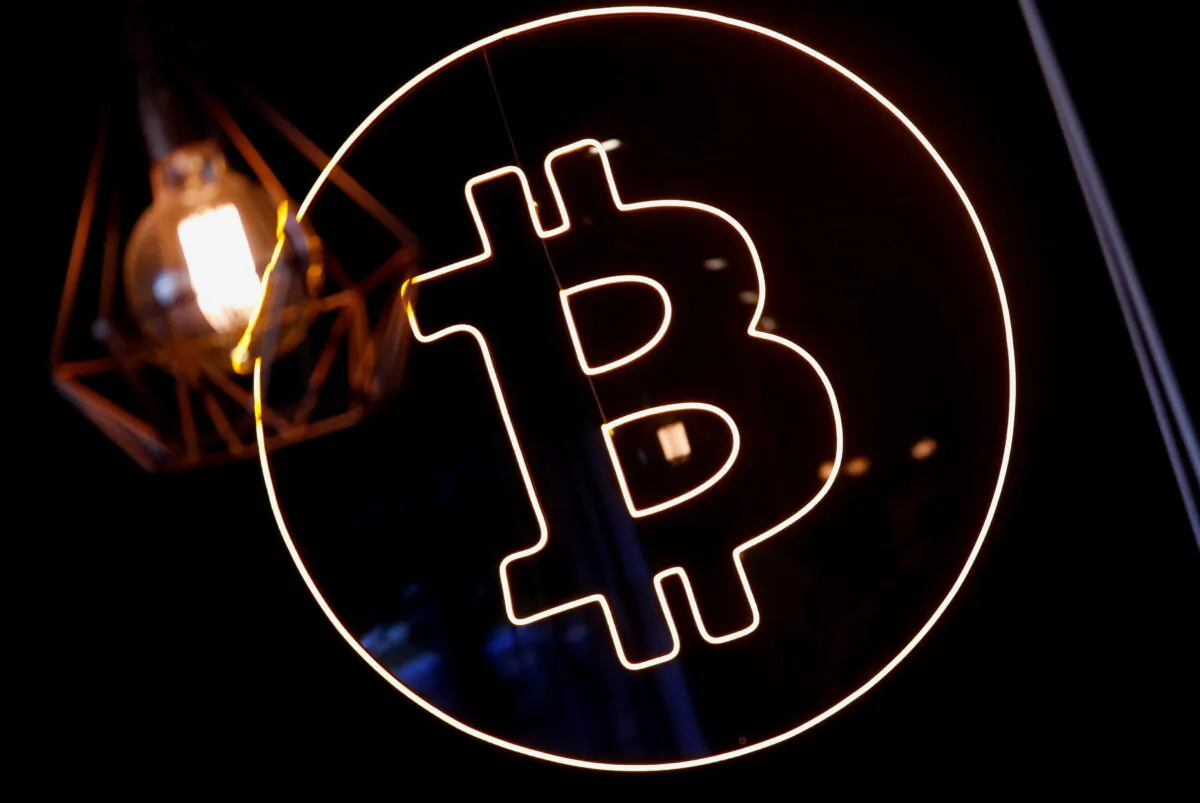 A neon logo of cryptocurrency Bitcoin is seen at the Crypstation cafe, in downtown Buenos Aires, Argentina, on May 5, 2022. (Agustin Marcarian/Reuters)