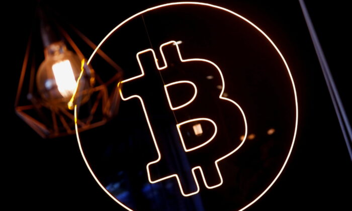 A neon logo of cryptocurrency Bitcoin is seen at the Crypstation cafe, in downtown Buenos Aires, Argentina, on May 5, 2022. (Agustin Marcarian/Reuters)