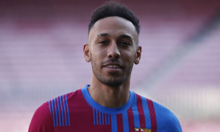 FC Barcelona's new signing Pierre-Emerick Aubameyang poses during the presentation at Camp Nou in Barcelona, Spain on Feb. 3, 2022. (Albert Gea/Reuters)