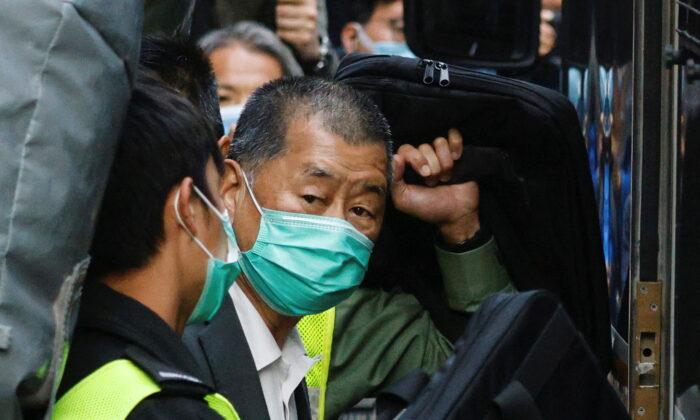 Media tycoon Jimmy Lai, founder of Apple Daily, looks on as he leaves the Court of Final Appeal by prison van, in Hong Kong, on Feb. 1, 2021. (Tyrone Siu/Reuters)