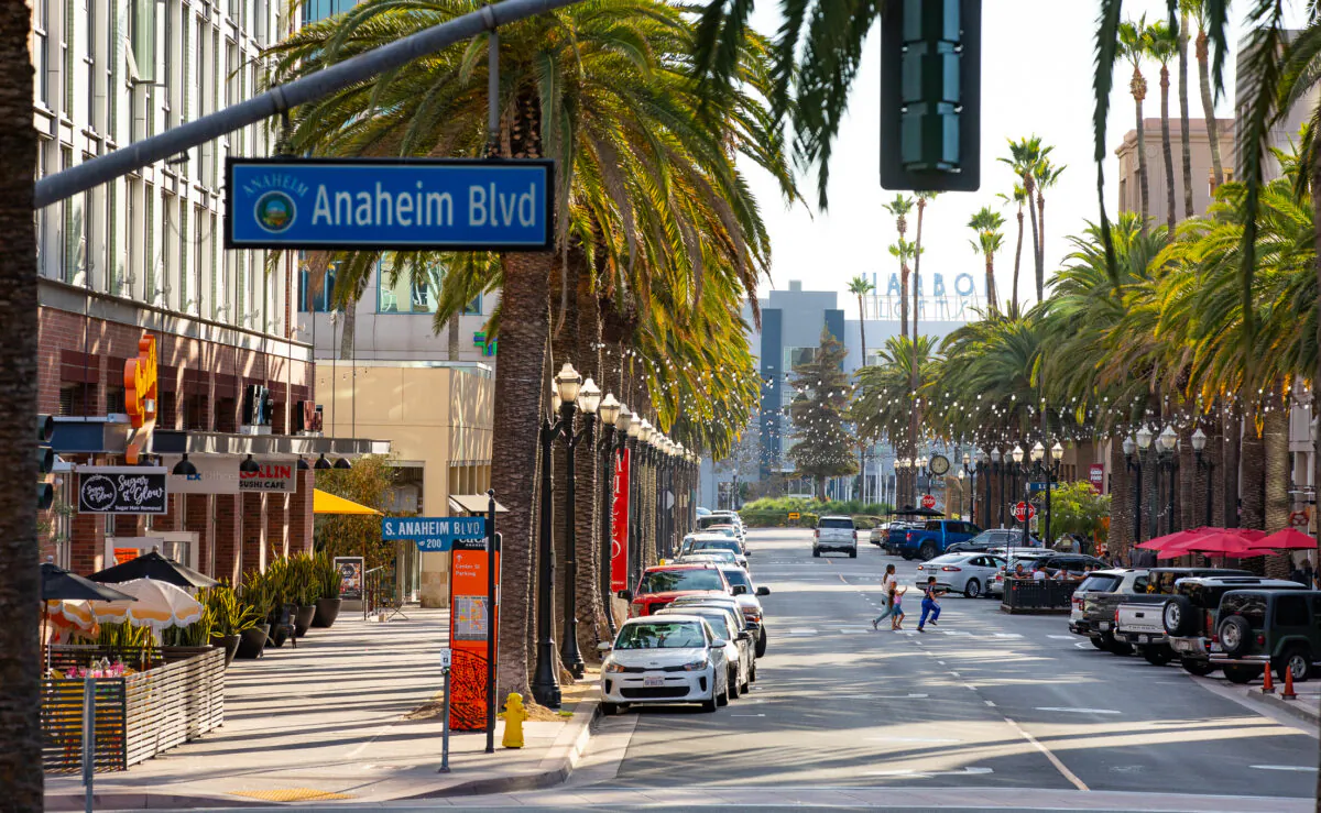 People walk near City Hall in Anaheim, Calif., on Aug. 9, 2022. (John Fredricks/The Epoch Times)