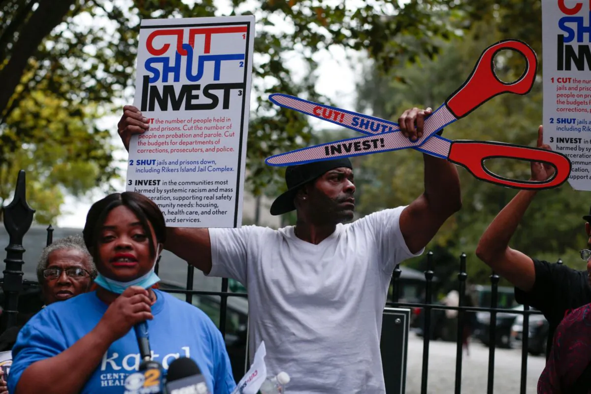 Demonstrators call for the closing of the Rikers Island prions as they protest outside the City Hall in New York, on September 22,2021. (Photo by KENA BETANCUR / AFP) (Photo by KENA BETANCUR/AFP via Getty Images)