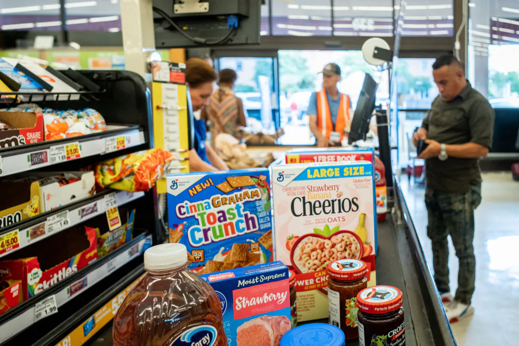 A cashier processes a customer's order in a Kroger grocery store in Houston, Texas, on July 15, 2022. (Photo by Brandon Bell/Getty Images)