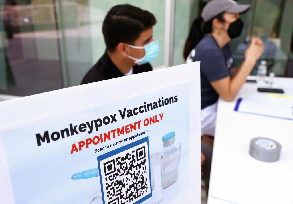 Health workers sit at a check-in table at a pop-up monkeypox vaccination clinic which opened today by the Los Angeles County Department of Public Health at the West Hollywood Library in West Hollywood, Calif. on August 3, 2022 (Mario Tama/Getty Images)