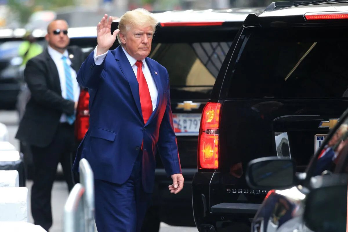 Former President Donald Trump waves while walking to a vehicle outside of Trump Tower in New York on Aug. 10, 2022. (Stringer/AFP via Getty Images)