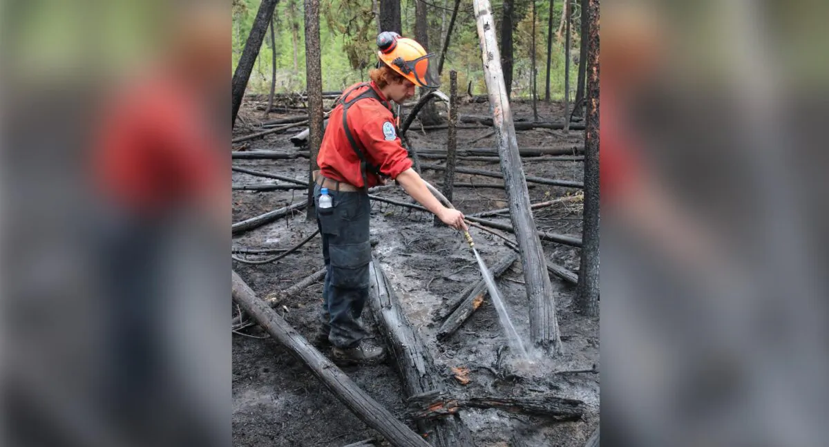 A crew member works at the Watching Creek fire in British Columbia in an Aug.5, 2022 handout photo. (The Canadian Press/HO/BC Wildfire Service)