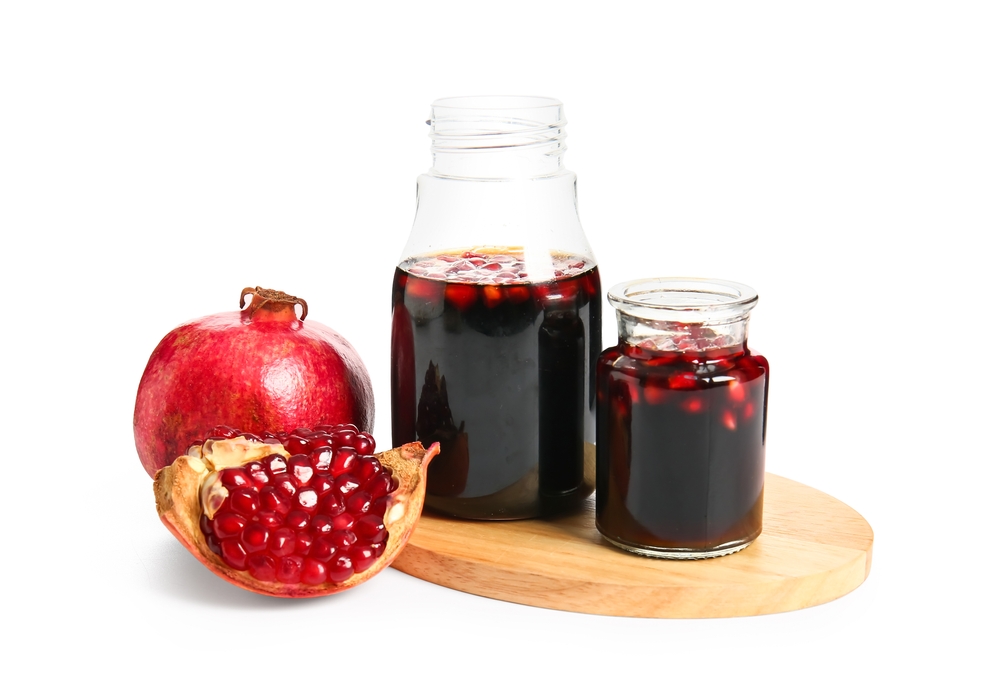 Jars,Of,Pomegranate,Molasses,On,White,Background