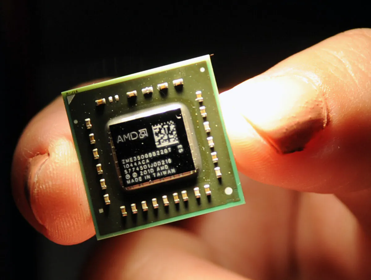 A chip the size of a coin, used in central processing units and a graphic processing units developed by the U.S.-headquartered Advanced Micro Devices (AMD), is displayed during a press conference held in Taipei, Taiwan, on May 24, 2011. (Sam Yeh/AFP via Getty Images)