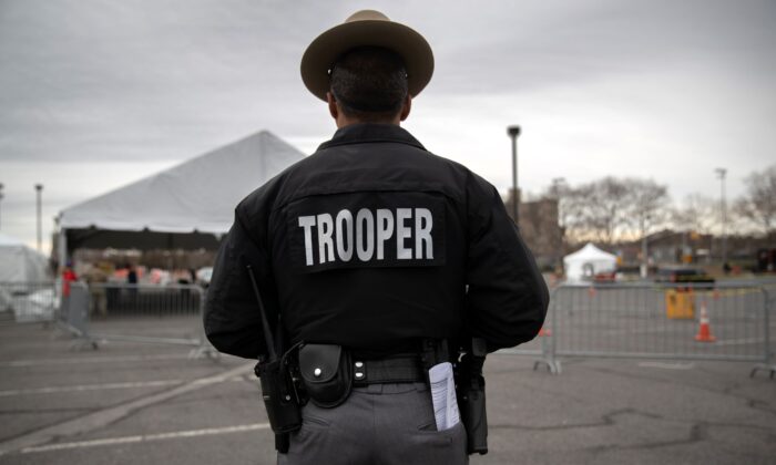 A New York State trooper stands in the Bronx, New York, on March 28, 2020. (John Moore/Getty Images)