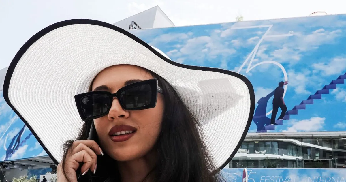 A woman talks on a mobile phone in Cannes, France, on May 16, 2022. (STEFANO RELLANDINI/AFP via Getty Images)