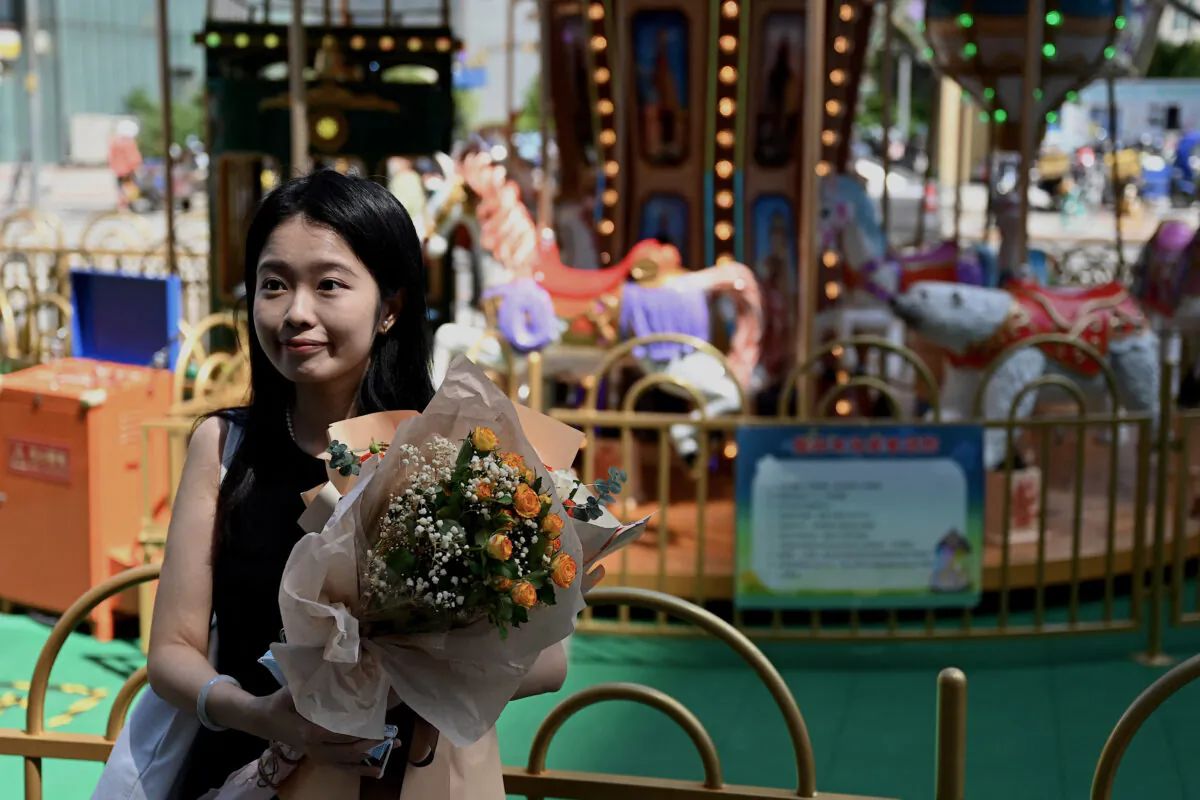 Zhou Xiaoxuan, also known as Xianzi, looks on as she arrives to attend a hearing in her sexual harassment case against prominent television host Zhu Jun at the Beijing No. 1 Intermediate People's Court in Beijing on August 10, 2022. (Noel Celis/AFP via Getty Images)
