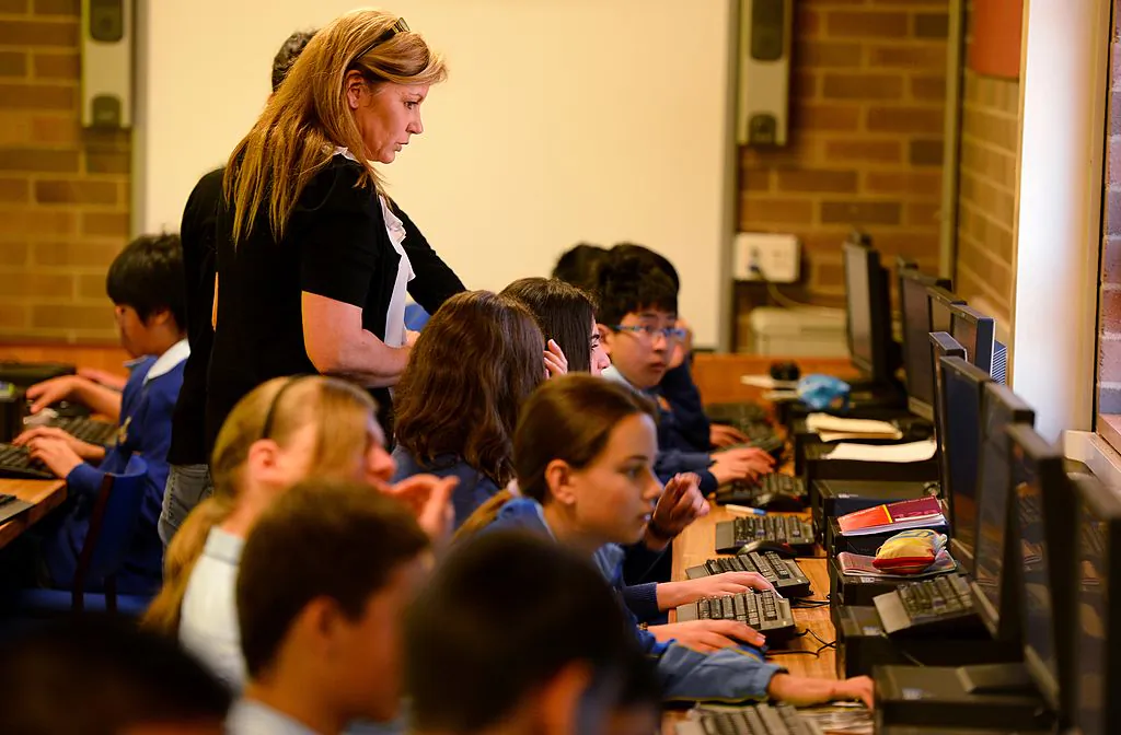Teacher Noeleen Lumby teaches Aboriginal languages to children at St Johns High School, in Sydney, Australia, on Oct. 14, 2012. (William West/AFP via Getty Images)