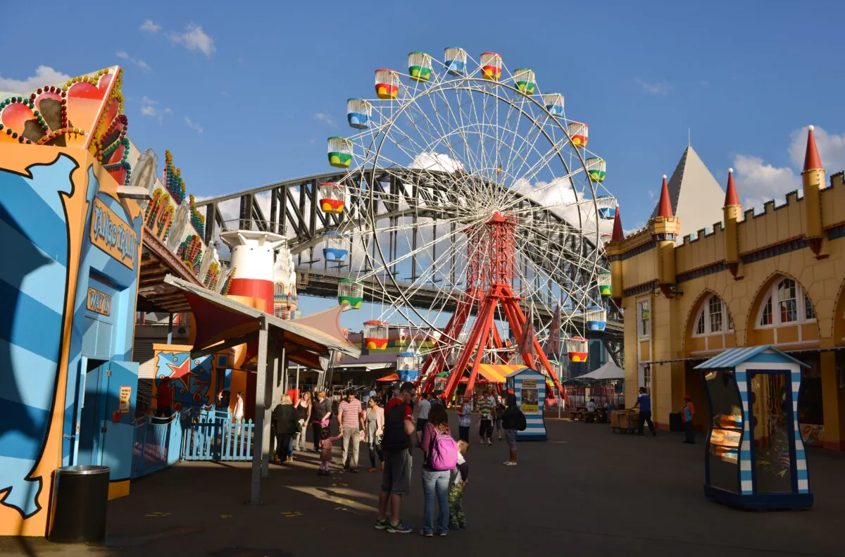 Visitors to Sydney's Luna Park fun fair enjoy bright autumn sunshine in Sydney, Australia, on June 2, 2014. (Peter Parks/AFP via Getty Images)