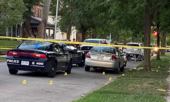 Evidence markers dot the scene on Richmond, Ind., on Aug. 10, 2022, where Richmond Police Department Officer Seara Burton was critically wounded and a man was injured in a shootout following a traffic stop. (Mike Emery/The Palladium-Item via AP)