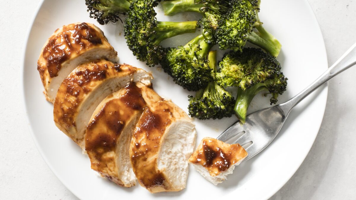This simple meal stars barbecue sauce-covered chicken breasts and yummy roasted broccoli. (Ashley Moore/Shutterstock)