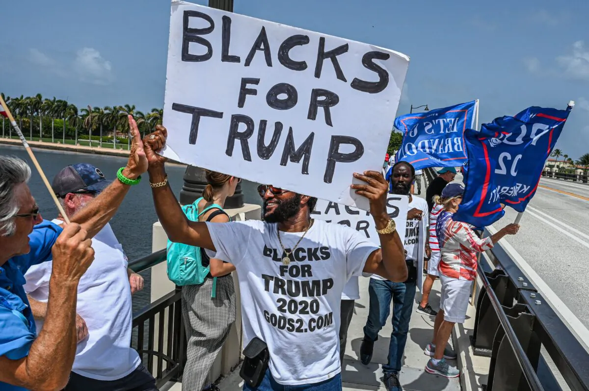 A day after the FBI raided former President Donald Trump's Mar-A-Lago home in Palm Beach, Fla., supporters gathered near the residence on Aug. 9, 2022.  (Giorgio Viera/AFP via Getty Images)