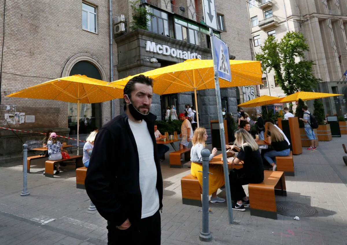 People enjoy outdoor McDonald's meal in downtown Kyiv, Ukraine, on June 9, 2020. (Efrem Lukatsky/AP Photo)
